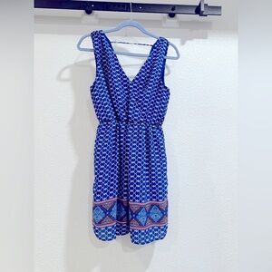 Fun loving V-neck and back mini. Bright blue and white geometric print. Large